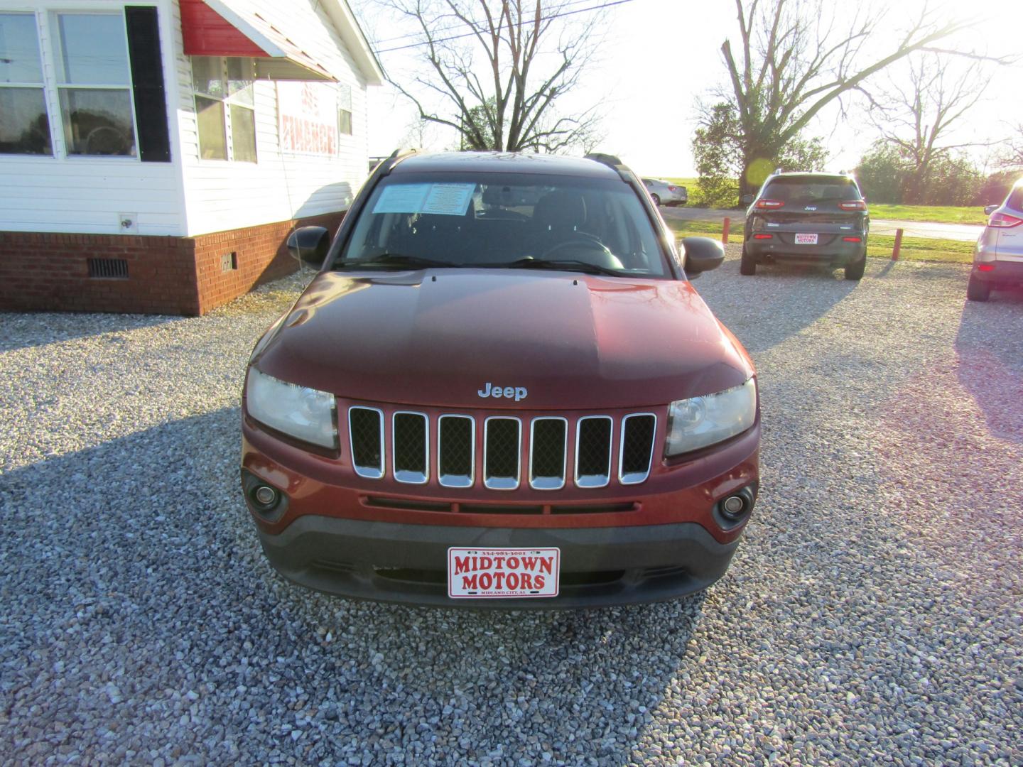 2016 Red /Gray Jeep Compass Sport FWD (1C4NJCBA3GD) with an 2.0L L4 DOHC 16V engine, Automatic transmission, located at 15016 S Hwy 231, Midland City, AL, 36350, (334) 983-3001, 31.306210, -85.495277 - Photo#1